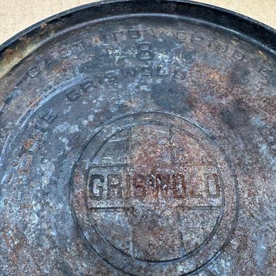Authentic vintage Griswold cast iron skillet, marked “Griswold” in a circle cross logo, “Erie, PA, U.S.A.”, number 608.