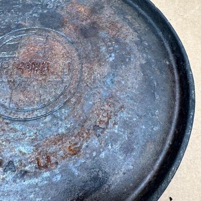 Authentic vintage Griswold cast iron skillet, marked “Griswold” in a circle cross logo, “Erie, PA, U.S.A.”, number 608.