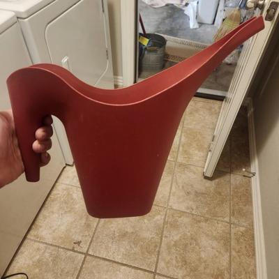 Red watering pitcher