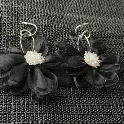 Cosmopolitan Chiffon black earrings featuring chiffon petals and iridescent beads.