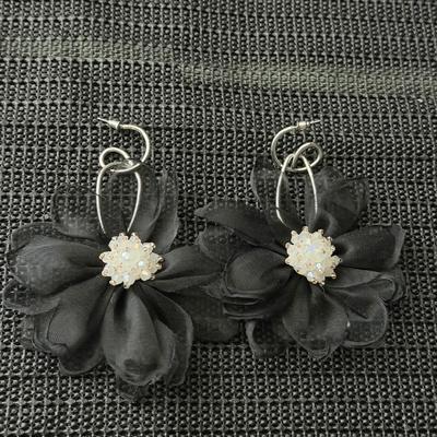 Cosmopolitan Chiffon black earrings featuring chiffon petals and iridescent beads.