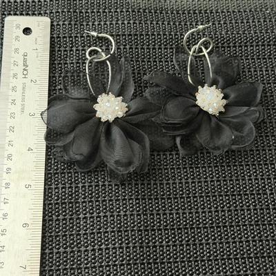 Cosmopolitan Chiffon black earrings featuring chiffon petals and iridescent beads.