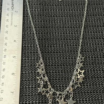 Silver tone necklace and earrings set stars
