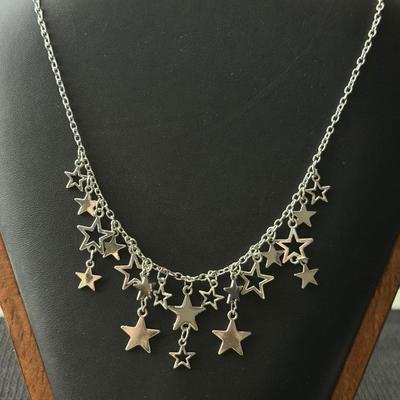 Silver tone necklace and earrings set stars