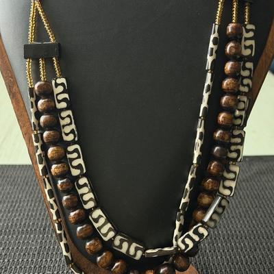 multi-layered African-inspired tribal necklace featuring bone and wood beads