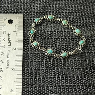 vintage silver-tone panel bracelet with faux turquoise oval stones.