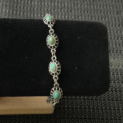 vintage silver-tone panel bracelet with faux turquoise oval stones.