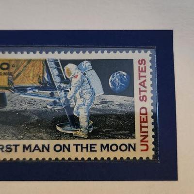 Sale Photo Thumbnail #450: This lot is for a copy of the First Man on The Moon Stamp Poster that has also been stamped and posted (1988) as a First Day Commemorative Issue.  Neil Armstrong made contact with the moon surface in 1969.  A rare and nice historical find.  Perfect for fr
