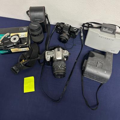 Sale Photo Thumbnail #16: Lot of 5 cameras
Fuji J10
Yashika
Nikon
2 Polaroid Instant Cameras
2 Quantary lens' & a lens case
290mm & 300mm lens
2nd lens is in the Nikon