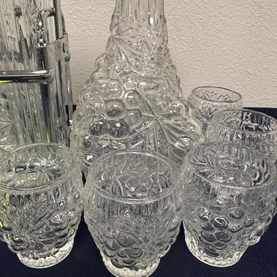 Sale Photo Thumbnail #33: Lot of
Labeled Bourbon & Vodka decanters in holder.
2 wine or liquor decanters, one has matching glasses