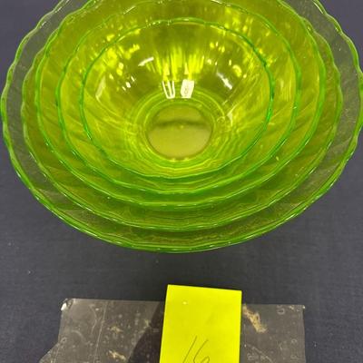 Sale Photo Thumbnail #37: Lot of Anchor Hocking Green Glass Nesting Bowls
They look like uranium glass but not tested