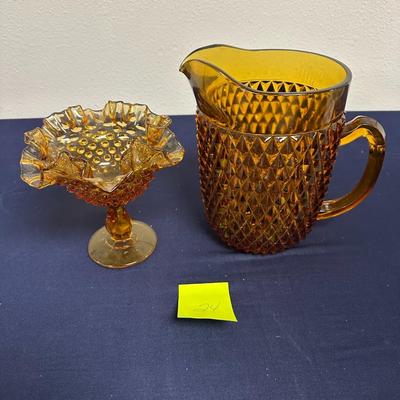 Sale Photo Thumbnail #56: Lot of 2 Amber Glass Items
Pitcher & candy dish
Unmarked but looks lije Fenton glasd