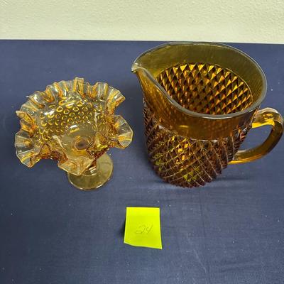 Sale Photo Thumbnail #57: Lot of 2 Amber Glass Items
Pitcher & candy dish
Unmarked but looks lije Fenton glasd