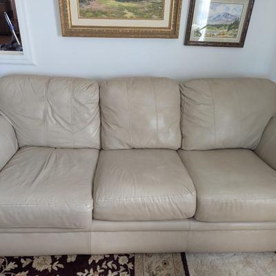 Sale Photo Thumbnail #5: Nice Lazy Boy Sofa, taupe in color, no tears or stains on the leather. The stain underneath the cushion is a water stain from a drink.