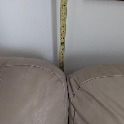 Sale Photo Thumbnail #2: Nice Lazy Boy Sofa, taupe in color, no tears or stains on the leather. The stain underneath the cushion is a water stain from a drink.