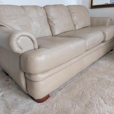 Sale Photo Thumbnail #11: Nice Lazy Boy Sofa, taupe in color, no tears or stains on the leather. The stain underneath the cushion is a water stain from a drink.