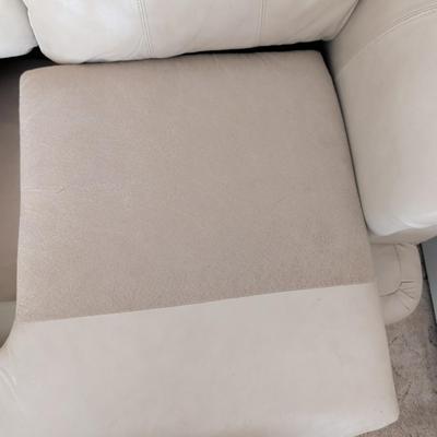 Sale Photo Thumbnail #9: Nice Lazy Boy Sofa, taupe in color, no tears or stains on the leather. The stain underneath the cushion is a water stain from a drink.