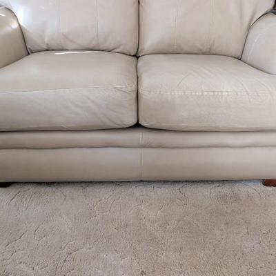 Sale Photo Thumbnail #27: Lazy Boy leather loveseat, taupe in color, no rips or stains on leather. The stain underneath the cushions is a water stain.