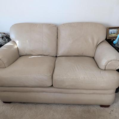 Sale Photo Thumbnail #24: Lazy Boy leather loveseat, taupe in color, no rips or stains on leather. The stain underneath the cushions is a water stain.