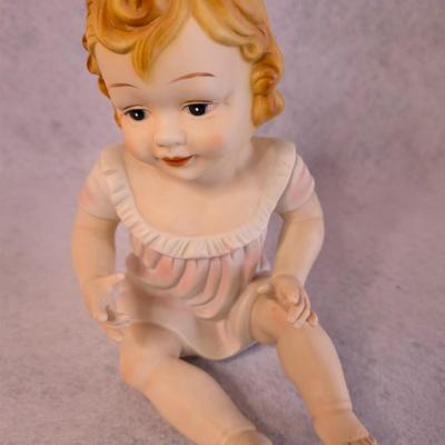 Sale Photo Thumbnail #400: Vintage Bisque Piano Babies figurines 
hand painted 
8.5 x 5 x 6.5
no flaws