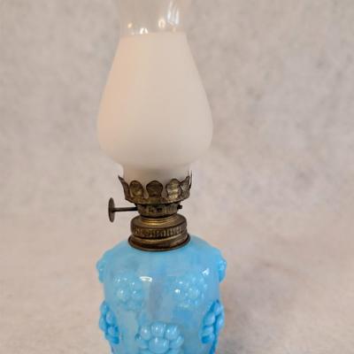 Sale Photo Thumbnail #408: Vintage Miniature Blue Glass Oil Lamp 
Embossed Floral or petal pattern base 
8.5 x 3