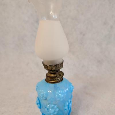 Sale Photo Thumbnail #407: Vintage Miniature Blue Glass Oil Lamp 
Embossed Floral or petal pattern base 
8.5 x 3