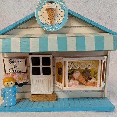 Sale Photo Thumbnail #414: St. Nicholas Square Village Ice Cream Shop Music Box 
As Music Play, the man comes out of the door and goes back in w/ door closing 
6x7x5