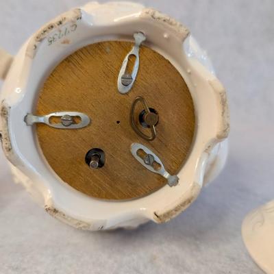 Sale Photo Thumbnail #455: Napcoware white teapot w/ lid and White Porcelain Flower girl bell 
Teapot: 7 x 8
Bell: 5.5 x 3