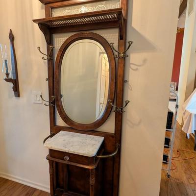 Sale Photo Thumbnail #497: Vintage Victorian style Hall Tree w/ Marble top and Swivel Mirror 
Beautiful Hall Tree, excellent condition 
7ft x 30 x 14 
marble top: 18 x 13
