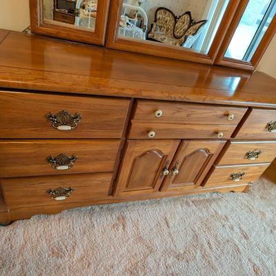 Sale Photo Thumbnail #504: 2 pc set Broyhill Furniture 9 drawer Oak Dresser w/ Tri Fold Mirror and Matching Oak Armoire
Both in Beautiful condition 
All drawers slide and function properly 
TV not included