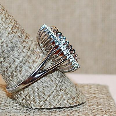 Size 10½ Marked .925 Large ORANGE AMBER Oval Stone with Nested Full Surround on a Silver Band (8.7g)