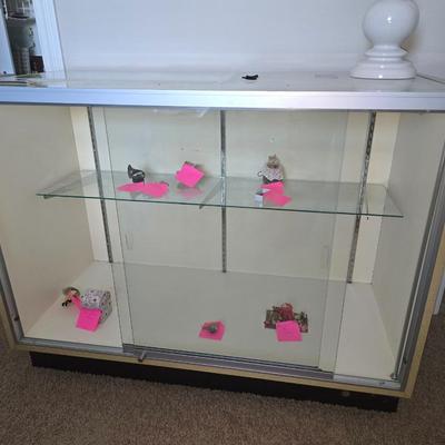 Glass case with doors