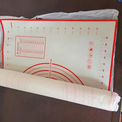 Sale Photo Thumbnail #541: Grater, big straws, red silicone baking and pastry mat with measurement markings, rolling pins, butter dish, serving platter, everything pictured