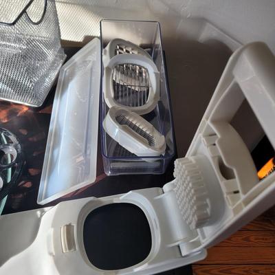 Sale Photo Thumbnail #537: Grater, big straws, red silicone baking and pastry mat with measurement markings, rolling pins, butter dish, serving platter, everything pictured
