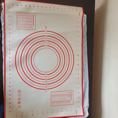 Sale Photo Thumbnail #540: Grater, big straws, red silicone baking and pastry mat with measurement markings, rolling pins, butter dish, serving platter, everything pictured
