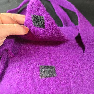 Sale Photo Thumbnail #462: This lot is for a Hand Made Felted Purple Purse.  It is actually darker than in the photo.  It is of a simple design with a felted box accent.  It has a zippered closer under the flap  It measures about 13-inches wide x 19-inches including straps,  It has