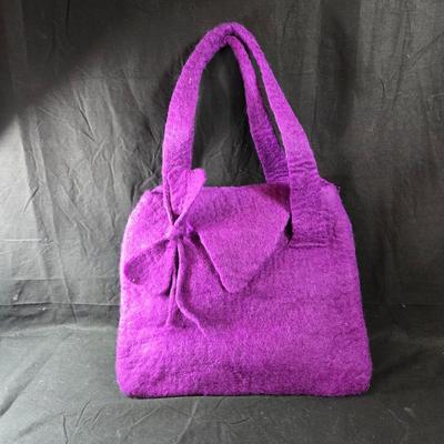 Sale Photo Thumbnail #460: This lot is for a Hand Made Felted Purple Purse.  It is actually darker than in the photo.  It is of a simple design with a felted box accent.  It has a zippered closer under the flap  It measures about 13-inches wide x 19-inches including straps,  It has