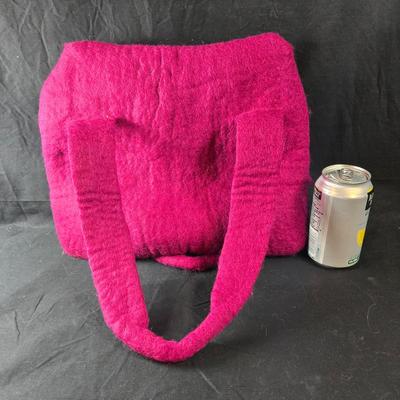 Sale Photo Thumbnail #466: This lot is for a Hand Made Felted Raspberry Colored Purse. It is actually darker than in the photo.  It is of a simple design with a felted box accent.  It has a zippered closer under the flap  It measures about 13-inches wide x 19-inches including strap