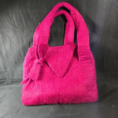 Sale Photo Thumbnail #464: This lot is for a Hand Made Felted Raspberry Colored Purse. It is actually darker than in the photo.  It is of a simple design with a felted box accent.  It has a zippered closer under the flap  It measures about 13-inches wide x 19-inches including strap
