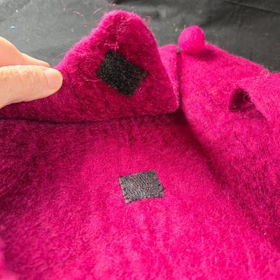 Sale Photo Thumbnail #468: This lot is for a Hand Made Felted Raspberry Colored Purse. It is actually darker than in the photo.  It is of a simple design with a felted box accent.  It has a zippered closer under the flap  It measures about 13-inches wide x 19-inches including strap