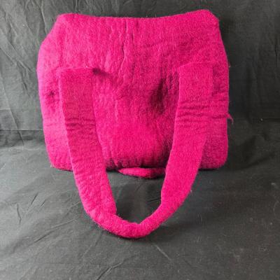 Sale Photo Thumbnail #465: This lot is for a Hand Made Felted Raspberry Colored Purse. It is actually darker than in the photo.  It is of a simple design with a felted box accent.  It has a zippered closer under the flap  It measures about 13-inches wide x 19-inches including strap