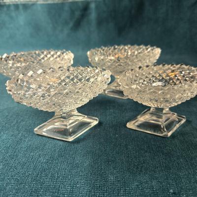 Sale Photo Thumbnail #479: This lot is for a grouping of Diamond Cut Footed Salt Cellars. This is a group of 4 salt cellars.  They are in very good shape, we found no chips or cracks.  They are unmarked and about 3-inches long. Would look nifty on the perfectly set table.