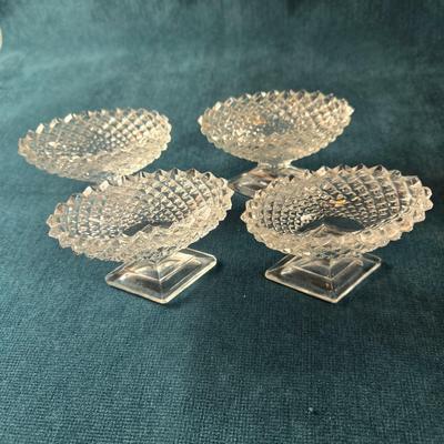 Sale Photo Thumbnail #477: This lot is for a grouping of Diamond Cut Footed Salt Cellars. This is a group of 4 salt cellars.  They are in very good shape, we found no chips or cracks.  They are unmarked and about 3-inches long. Would look nifty on the perfectly set table.