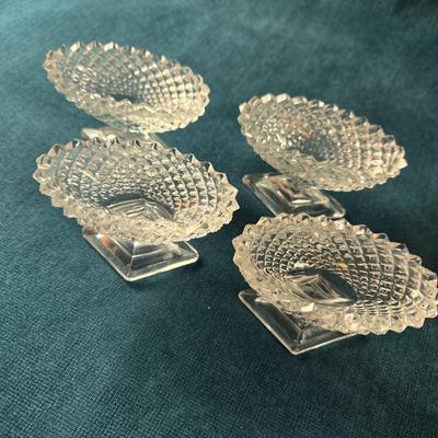 Sale Photo Thumbnail #478: This lot is for a grouping of Diamond Cut Footed Salt Cellars. This is a group of 4 salt cellars.  They are in very good shape, we found no chips or cracks.  They are unmarked and about 3-inches long. Would look nifty on the perfectly set table.