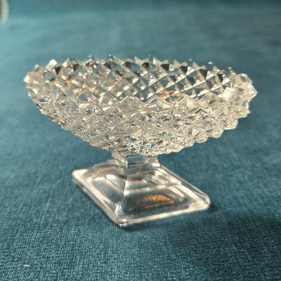 Sale Photo Thumbnail #482: This lot is for a grouping of Diamond Cut Footed Salt Cellars. This is a group of 4 salt cellars.  They are in very good shape, we found no chips or cracks.  They are unmarked and about 3-inches long. Would look nifty on the perfectly set table.