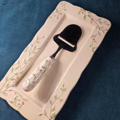Sale Photo Thumbnail #484: This lot is for a Ceramic Cheese Tray with Matching Cheese Knife.  This is a lovely Cheese Tray with matching Cheese Knife.  It has never been use.  It measures about 13-inches long X 6.5-inches wide.