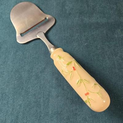 Sale Photo Thumbnail #489: This lot is for a Ceramic Cheese Tray with Matching Cheese Knife.  This is a lovely Cheese Tray with matching Cheese Knife.  It has never been use.  It measures about 13-inches long X 6.5-inches wide.