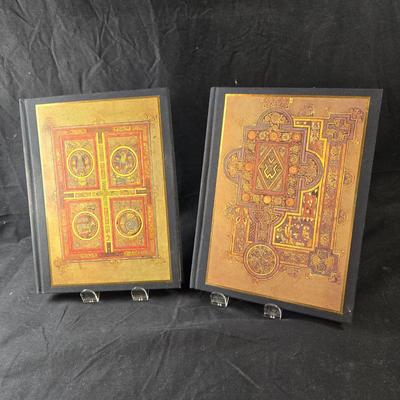 Sale Photo Thumbnail #495: This lot is for a Book of Kells Journals. This is a set of Journals with the covers depicting a page from the Book of Kells.  One journal has lined pages the other has blank pages.  They are both unused.  They are about 9.25-inches tall x 7-inches wide.