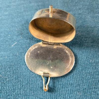 Sale Photo Thumbnail #510: This lot is for a Vintage Compact & Pill Box.   It is marked Elgin America. The design is Art Deco and the center is a large Mother of Pear square - very attractive.  Note that the compact does have a cracked mirror but otherwise in very good condition fo