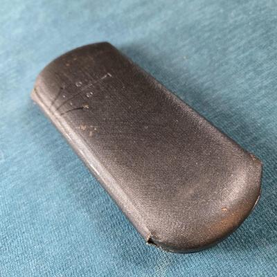 Sale Photo Thumbnail #516: This lot is for an Antique Eye Glass in Original Case. This is a nice set of Antique Eye Glasses with Original Case.  The case is clearly marked as to where it is from and has an Art Deco Design.  The eye glass rims are gold colored but not marked if they